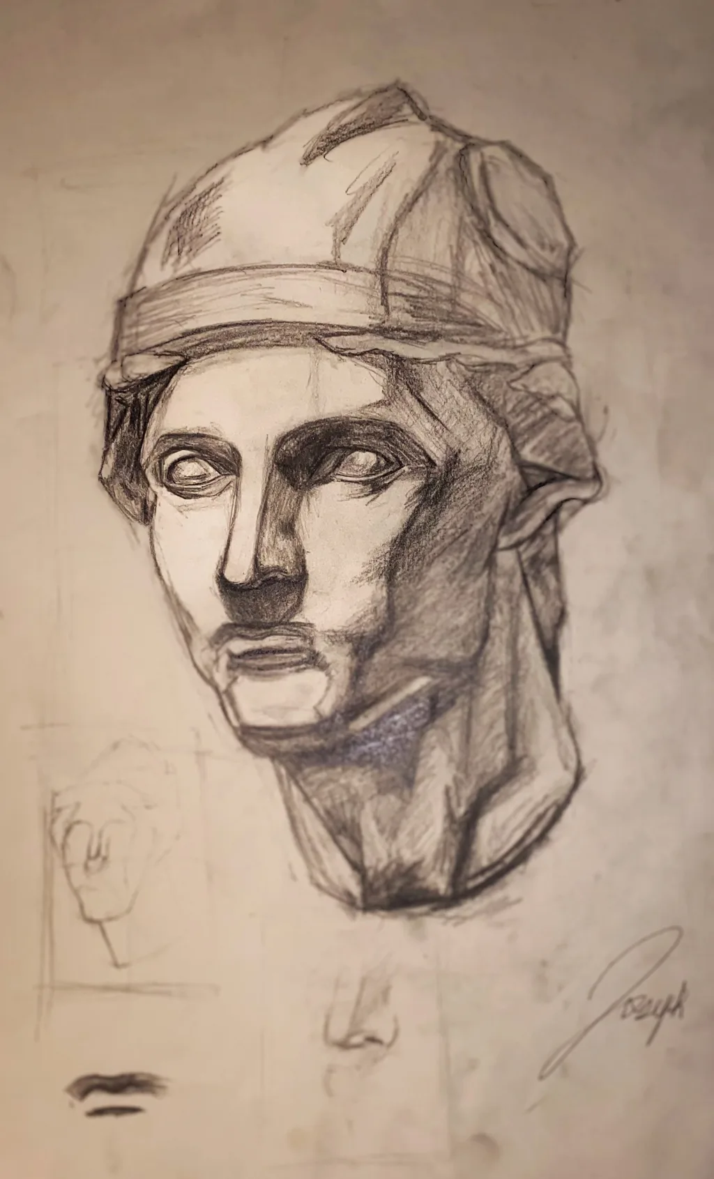 Graphite study of a classical plaster head wearing a helmet