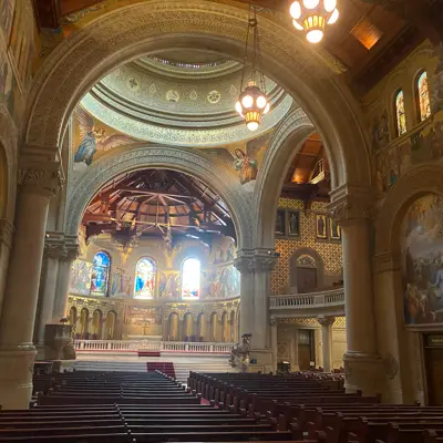 Interior of Stanford Memorial Church with mosaics and pews